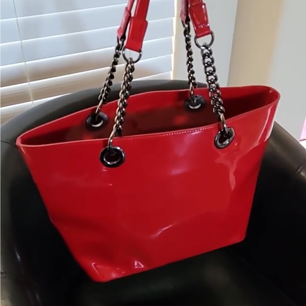 Candy Apple patent Red DKNY purse. New condition !17 inches by 11 1/2